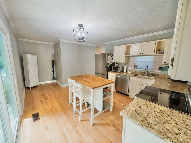 3905 Hunt Dr SE, Gainesville, GA 30507 - kitchen featuring open shelves, stainless steel appliances, butcher block countertops, light wood-style floors, and crown molding