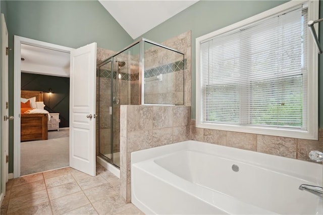full bathroom with tile patterned floors, connected bathroom, a shower stall, lofted ceiling, and a garden tub