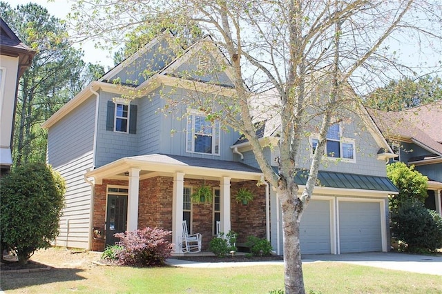 view of front of property featuring a garage and concrete driveway