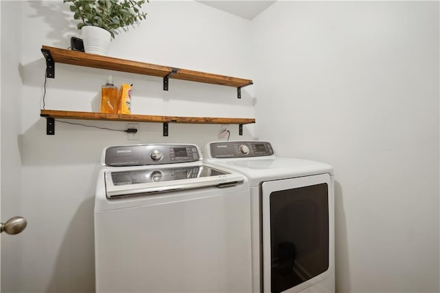 laundry room featuring washer and dryer and laundry area