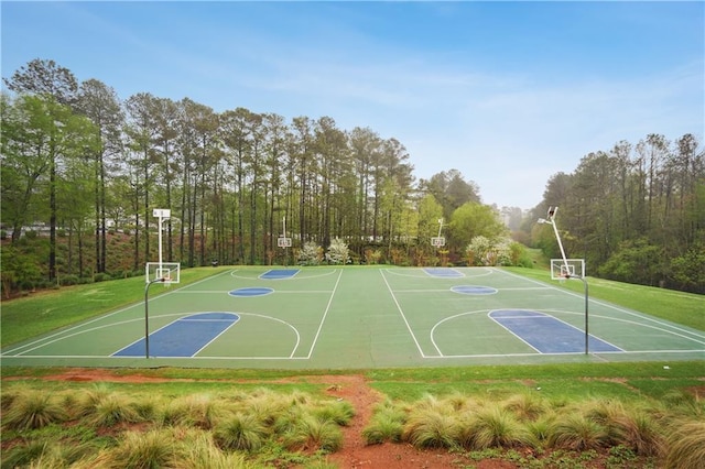 view of sport court with community basketball court and a lawn
