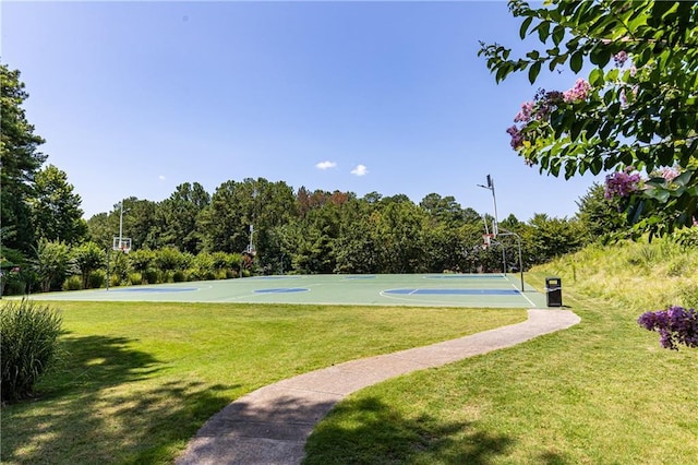 view of basketball court with a yard and community basketball court