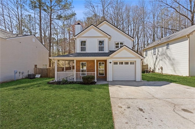 view of front of home with brick siding, a chimney, a porch, driveway, and a front lawn