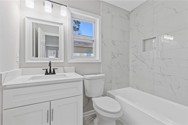 full bath featuring vanity, toilet, and baseboards