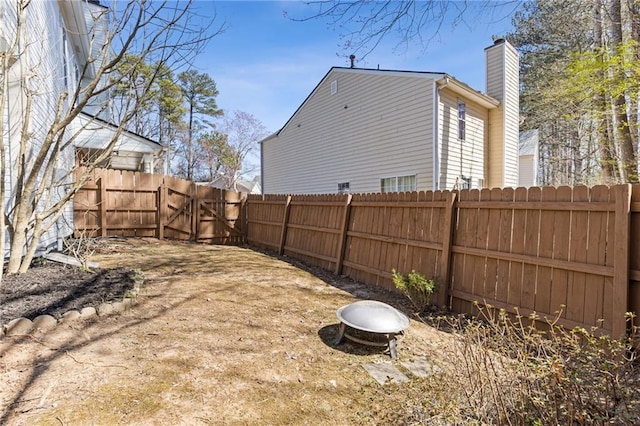 view of yard featuring fence private yard and a gate