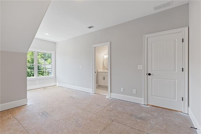 unfurnished bedroom with ensuite bathroom