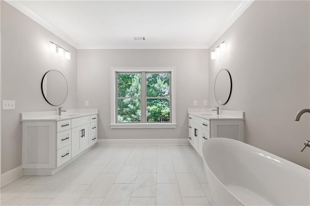 bathroom with vanity, a bath, and crown molding