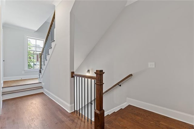 stairs featuring hardwood / wood-style floors