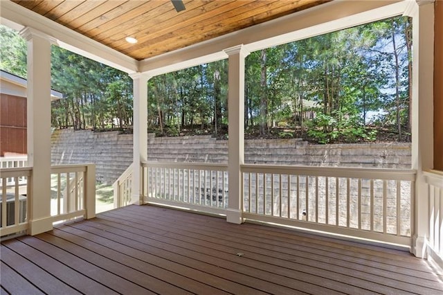 wooden deck featuring ceiling fan