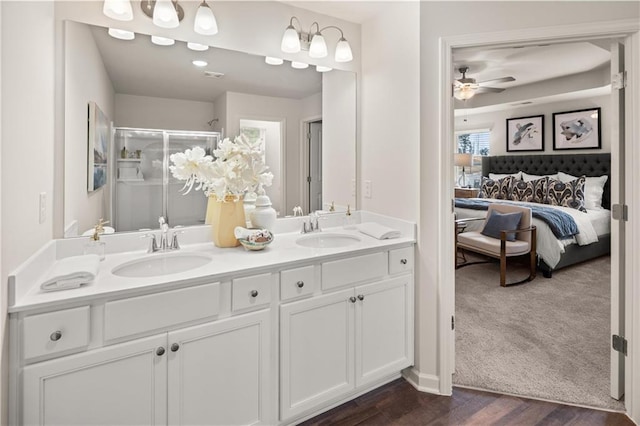 224 Epping St Unit 7, Stockbridge, GA 30281 - full bath with double vanity, ensuite bath, a stall shower, a ceiling fan, and wood finished floors