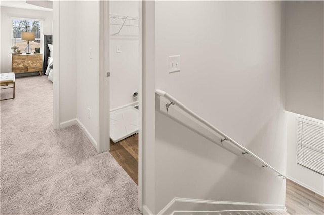 224 Epping St Unit 7, Stockbridge, GA 30281 - hall featuring an upstairs landing, baseboards, carpet flooring, and wood finished floors