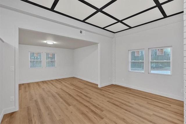 empty room featuring plenty of natural light and light wood-type flooring