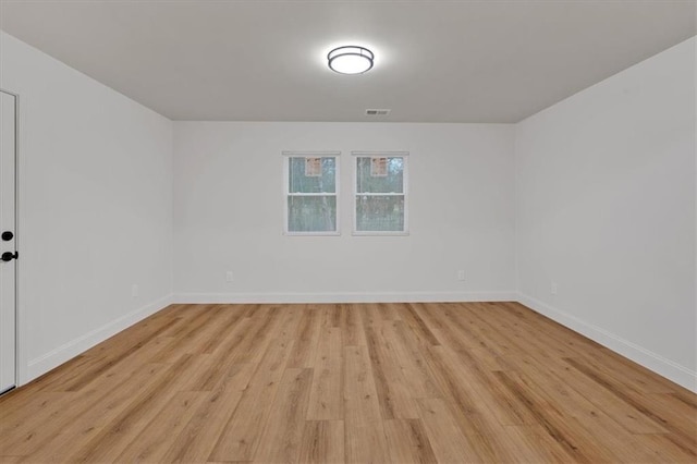 spare room featuring light hardwood / wood-style flooring