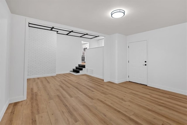 basement featuring light hardwood / wood-style flooring