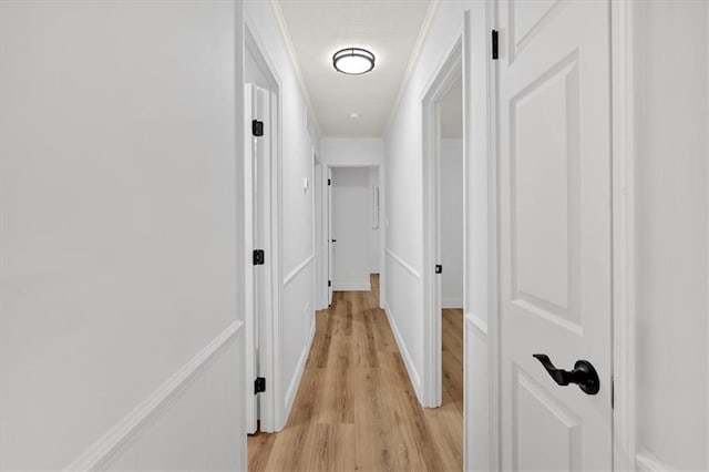 hall with light hardwood / wood-style floors