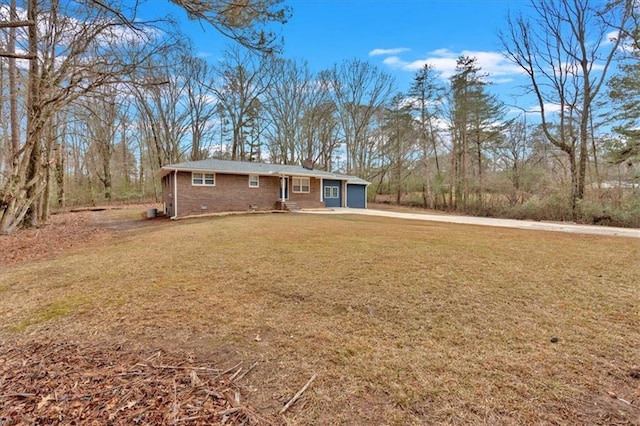 exterior space with a yard and a garage