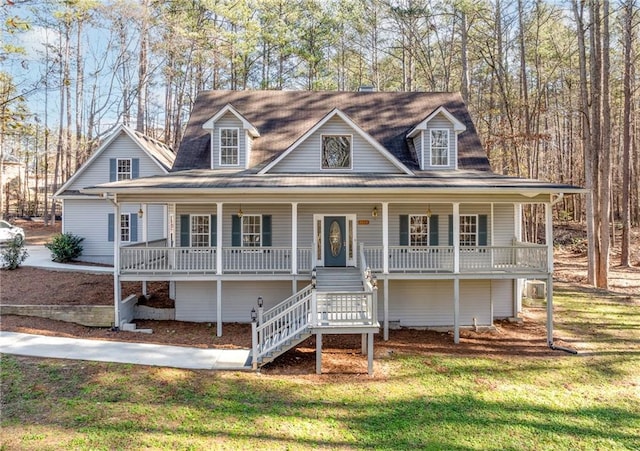 view of front of home with a front lawn and covered porch