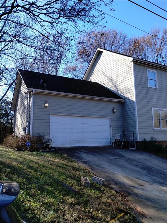 view of side of home featuring a garage