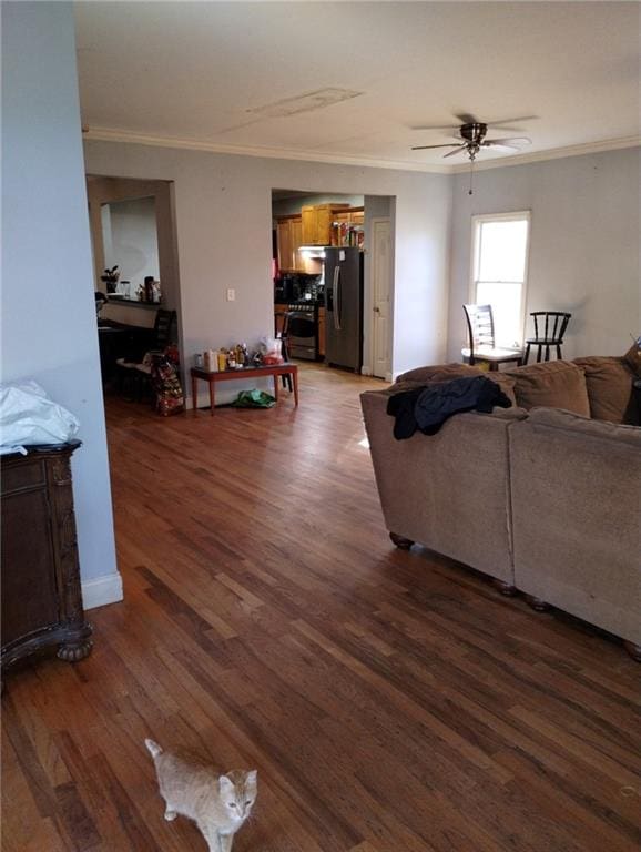 living room featuring crown molding, ceiling fan, and dark hardwood / wood-style flooring