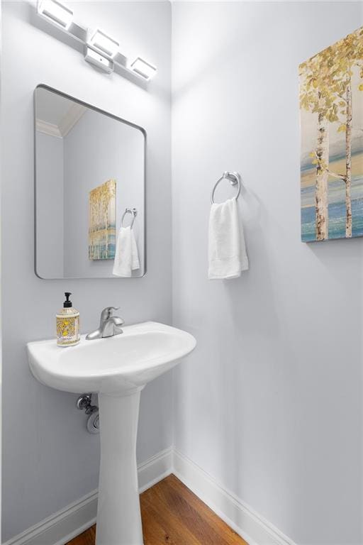 bathroom featuring baseboards and wood finished floors