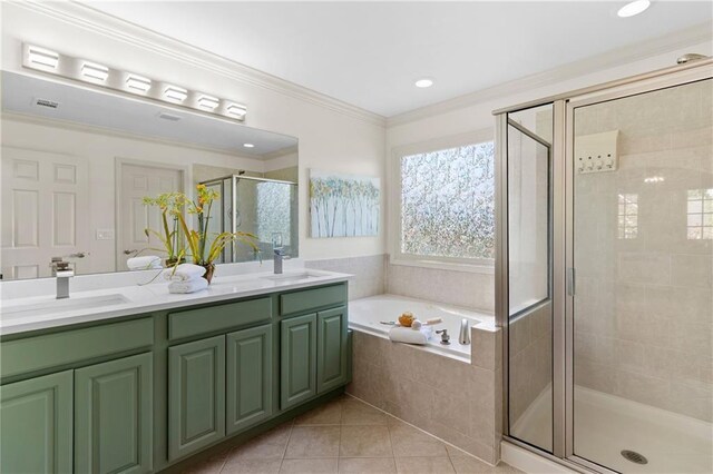 bathroom featuring a sink, a stall shower, and double vanity