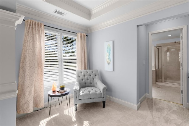 living area with crown molding, carpet flooring, visible vents, and baseboards
