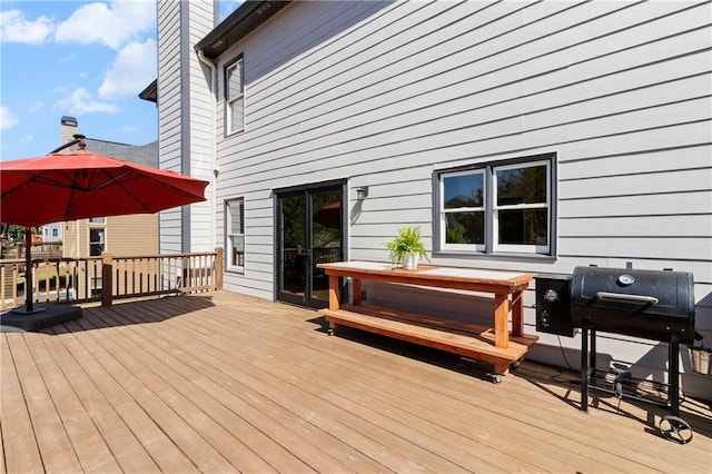 wooden deck featuring grilling area