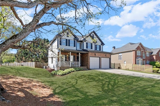 view of front of property with a garage, fence, driveway, and covered porch