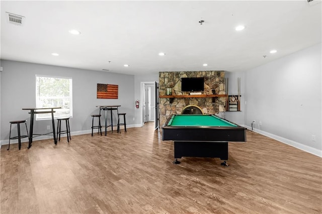 playroom featuring baseboards, recessed lighting, wood finished floors, and visible vents