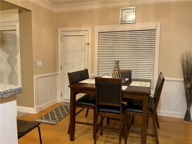 1162 Mason Lee, Loganville, GA 30052 - dining room featuring wainscoting, baseboards, crown molding, and wood finished floors