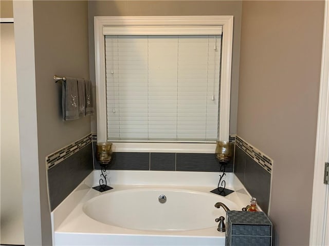 1162 Mason Lee, Loganville, GA 30052 - bathroom featuring a garden tub