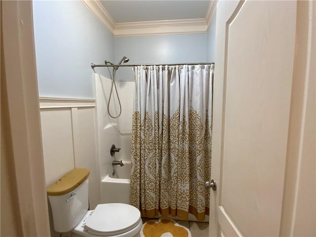 1162 Mason Lee, Loganville, GA 30052 - bathroom featuring a wainscoted wall, toilet, crown molding, shower / tub combo with curtain, and a decorative wall
