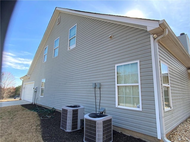 1162 Mason Lee, Loganville, GA 30052 - view of property exterior with central air condition unit and a garage