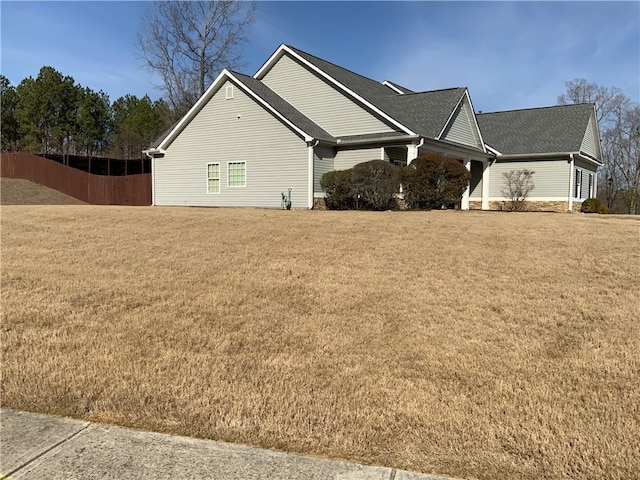 1162 Mason Lee, Loganville, GA 30052 - view of side of home with a lawn and roof with shingles