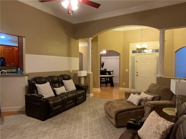 1162 Mason Lee, Loganville, GA 30052 - living area with ceiling fan with notable chandelier, decorative columns, arched walkways, and ornamental molding