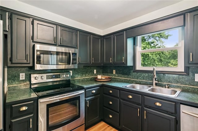 5010 Truman Mountain Rd, Gainesville, GA 30506 - kitchen featuring stainless steel appliances, a sink, dark countertops, and tasteful backsplash