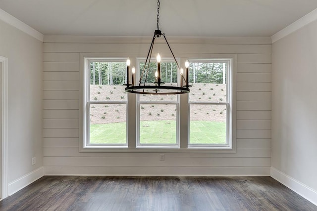 unfurnished dining area featuring dark wood-style floors and a wealth of natural light