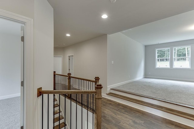 interior space featuring baseboards, wood finished floors, and recessed lighting