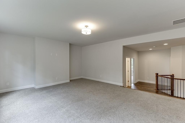 spare room featuring recessed lighting, visible vents, and baseboards