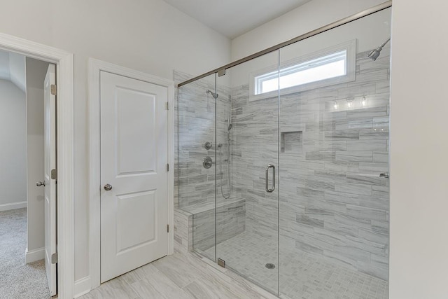 bathroom featuring a shower stall