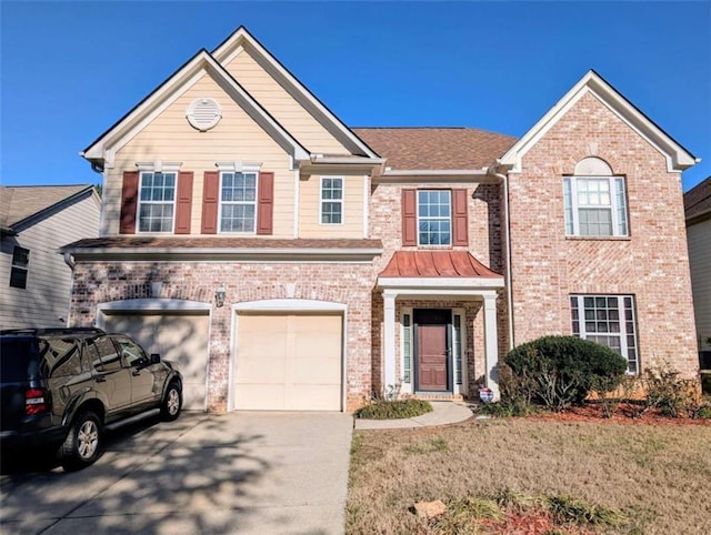 view of front of house with brick siding, driveway, and an attached garage