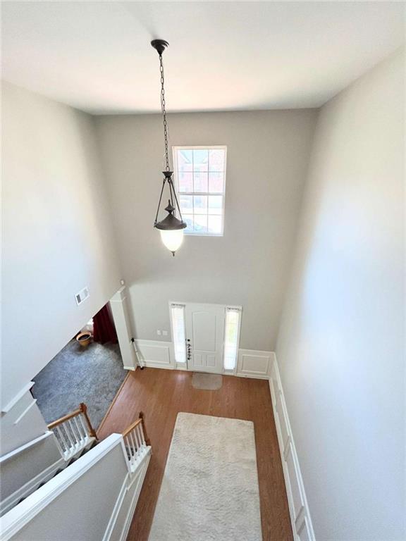 entryway with visible vents and wood finished floors