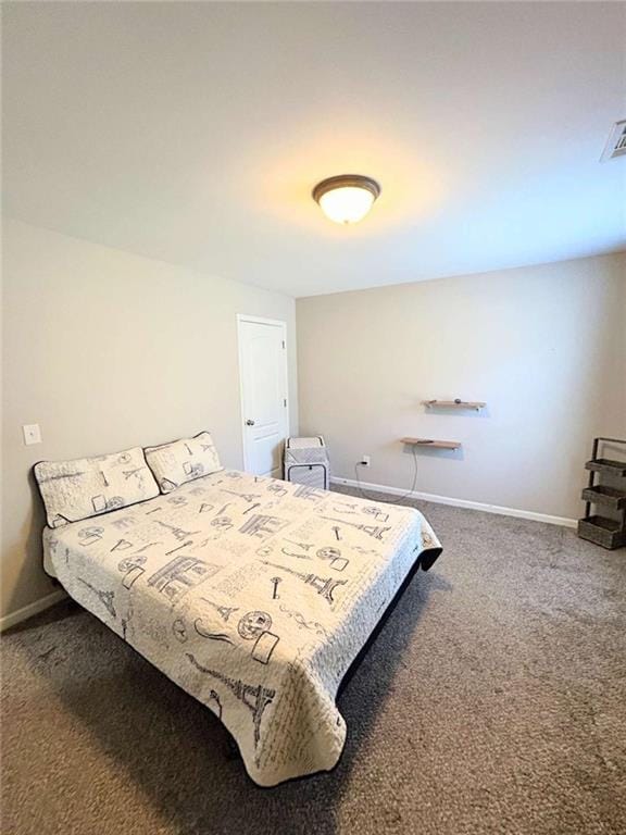 carpeted bedroom with visible vents and baseboards