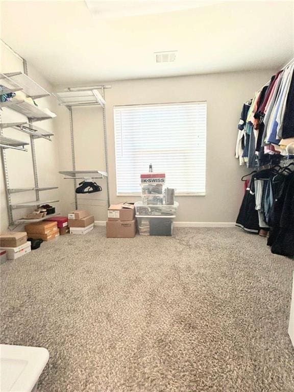 walk in closet featuring carpet flooring and visible vents