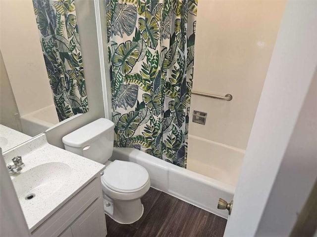 bathroom with vanity, toilet, and hardwood / wood-style floors