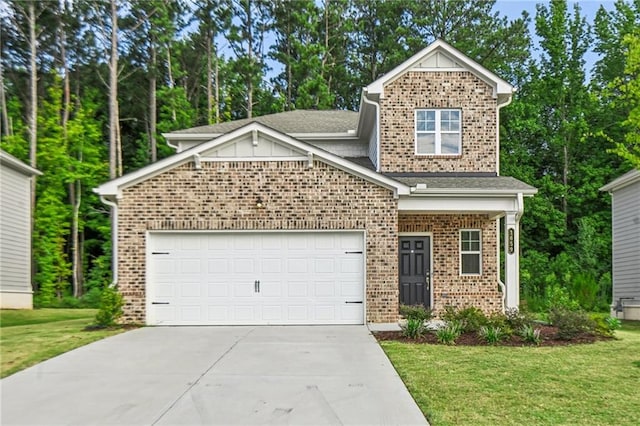 view of front of property featuring a garage and a front yard