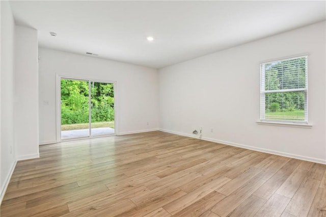 empty room with light hardwood / wood-style floors