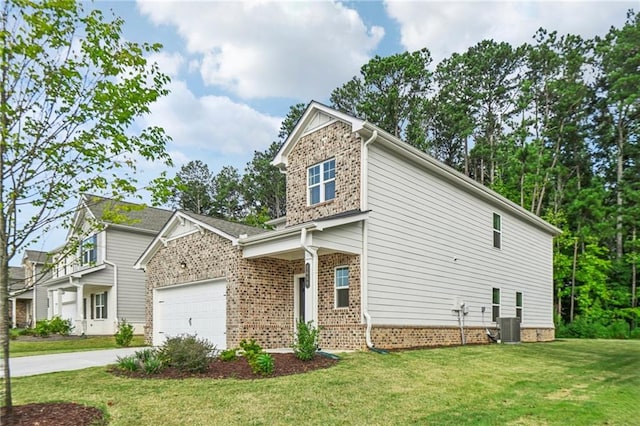 view of front of house featuring a front lawn and a garage