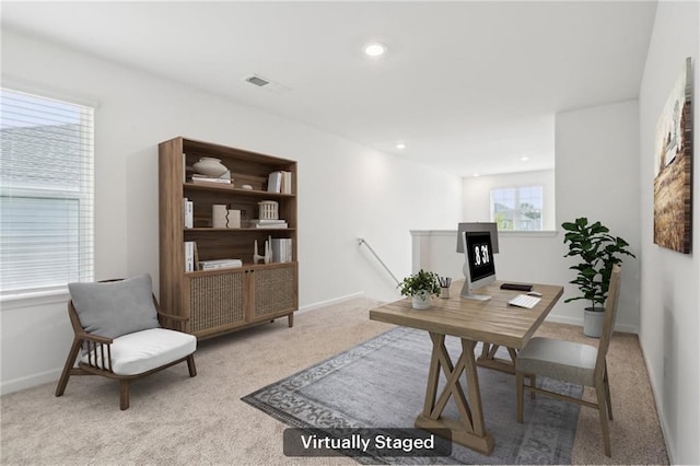 carpeted home office featuring plenty of natural light