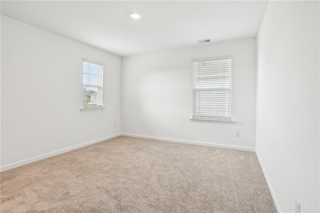 unfurnished room featuring carpet flooring